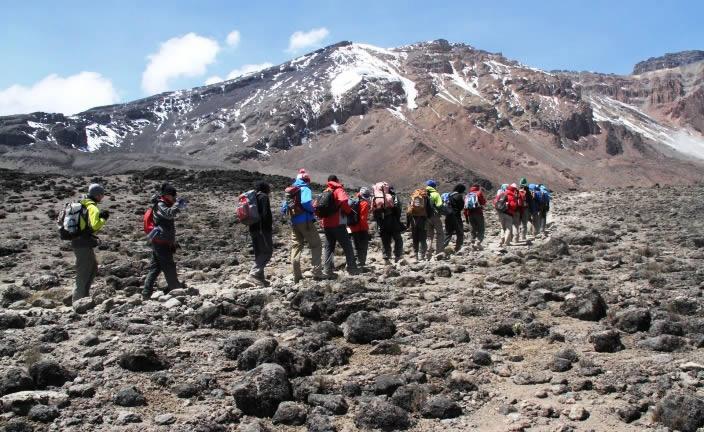 Trekkers in the Machame source